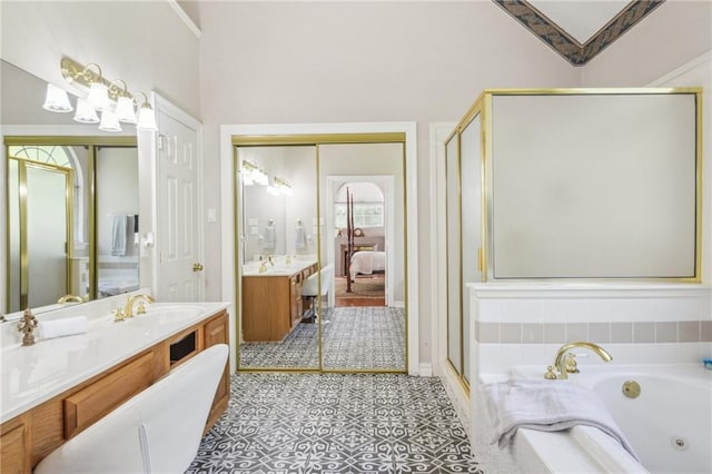 10 Catalpa Trce, Covington, LA 70433 - ensuite bathroom featuring a tub with jets, a stall shower, and vanity