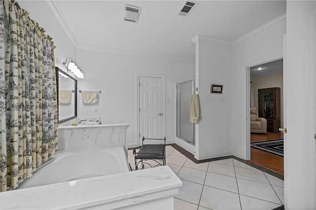 bathroom with vanity, separate shower and tub, ornamental molding, and tile patterned floors