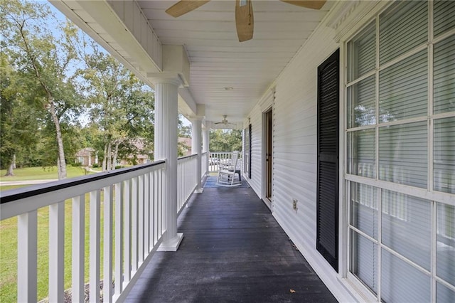 balcony featuring ceiling fan and a porch