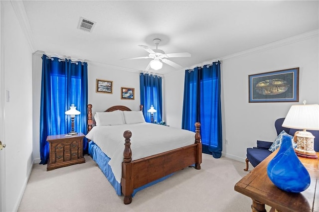 carpeted bedroom featuring crown molding and ceiling fan