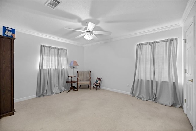 living area featuring ceiling fan, light colored carpet, and crown molding