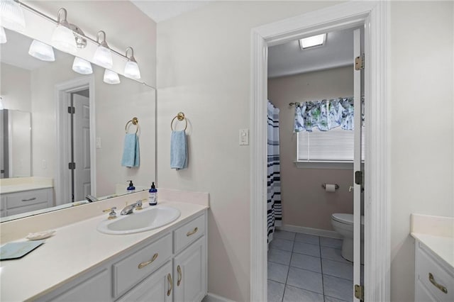 bathroom featuring tile patterned floors, vanity, and toilet