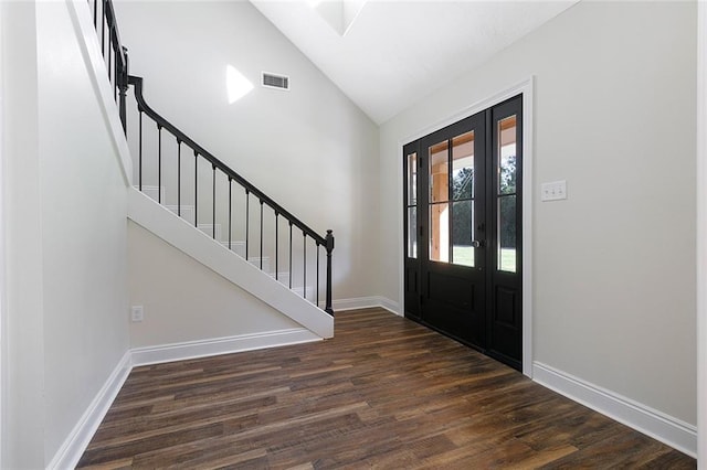 foyer featuring high vaulted ceiling and dark hardwood / wood-style flooring