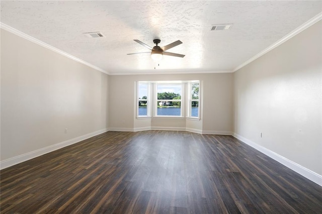 unfurnished room with ornamental molding, ceiling fan, and dark wood-type flooring