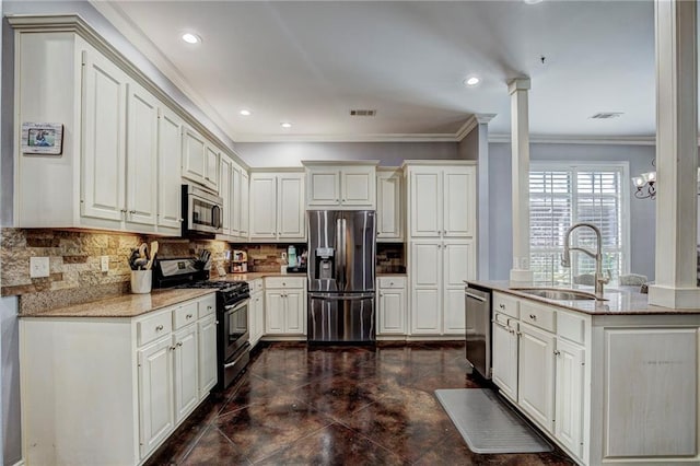 18 Pin Oak Ln, Hammond, LA 70401 - kitchen with stainless steel appliances, a sink, crown molding, light stone countertops, and tasteful backsplash