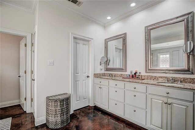 bathroom featuring ornamental molding and vanity