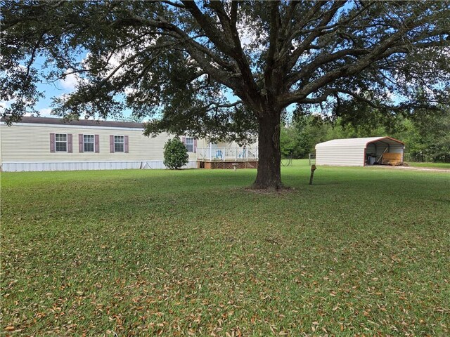 view of yard featuring a carport