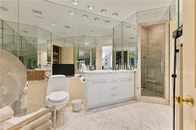 bathroom with vanity, toilet, and a shower with door