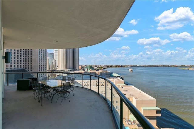 balcony featuring a water view