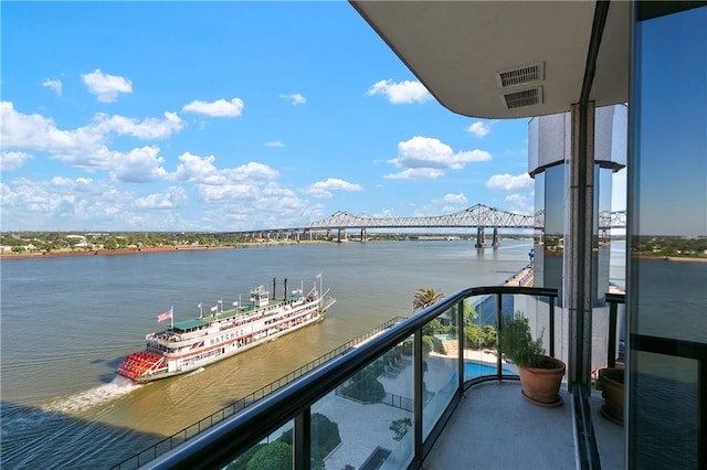 balcony featuring a water view