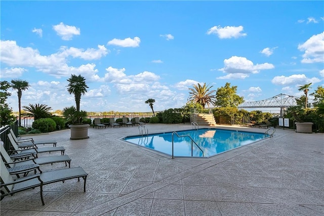 view of swimming pool featuring a patio area