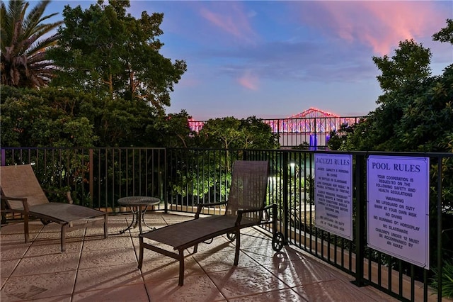 view of patio terrace at dusk