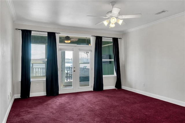 carpeted spare room with french doors, ceiling fan, and crown molding