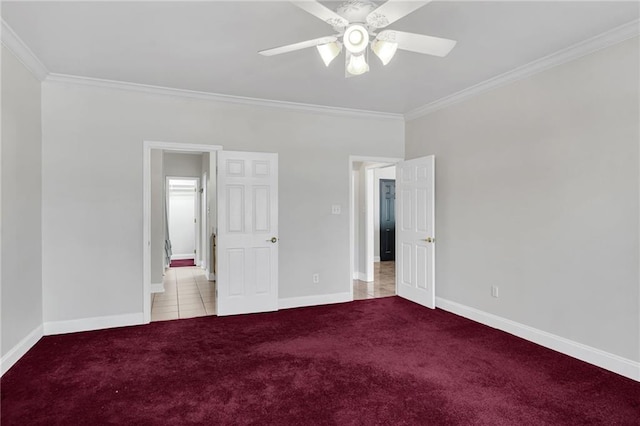 unfurnished bedroom with ceiling fan, ornamental molding, and light carpet