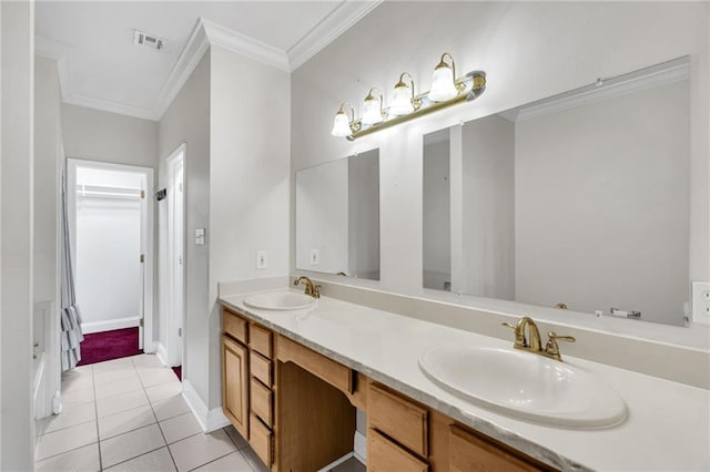 bathroom with crown molding, tile patterned floors, and vanity