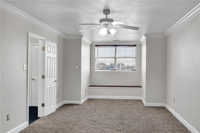 carpeted empty room featuring crown molding and ceiling fan