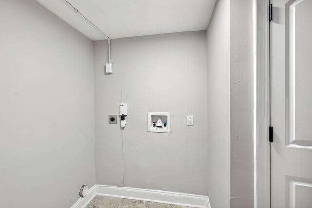 clothes washing area featuring washer hookup and hookup for an electric dryer