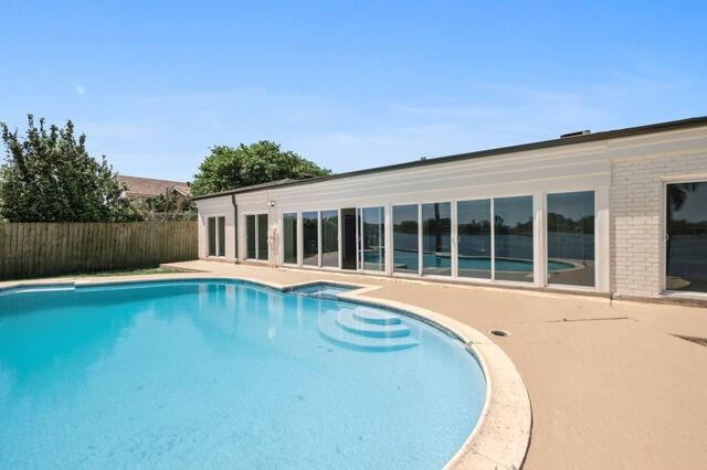 view of pool featuring a patio