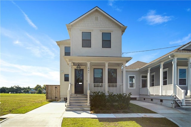 view of front of house with a front lawn and a porch