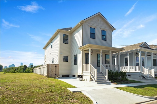 view of front of house featuring a porch and a front lawn