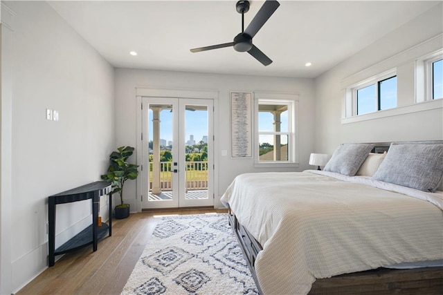 bedroom featuring ceiling fan, light wood-type flooring, french doors, and access to exterior