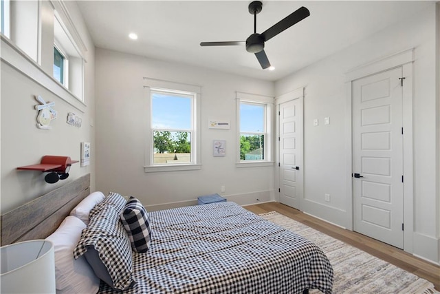 bedroom featuring light wood-type flooring and ceiling fan