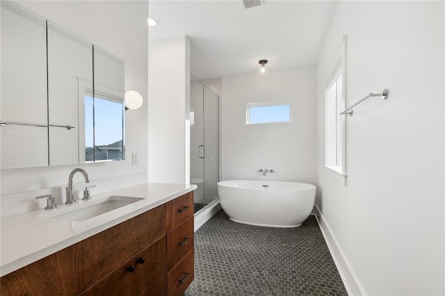 bathroom featuring vanity, shower with separate bathtub, and tile patterned floors