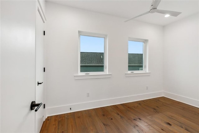 spare room featuring ceiling fan and hardwood / wood-style flooring