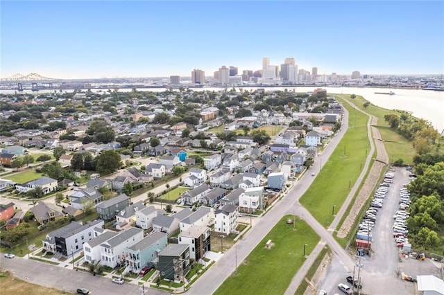 birds eye view of property with a water view and a city view