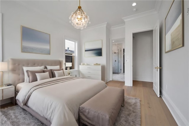 bedroom with light hardwood / wood-style flooring, a notable chandelier, and crown molding