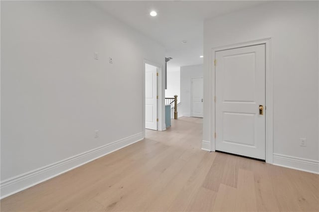 spare room with light hardwood / wood-style floors