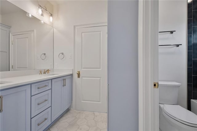 bathroom with vanity and toilet