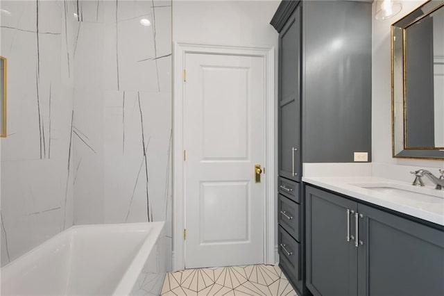 bathroom featuring vanity, tile patterned floors, and a bathing tub