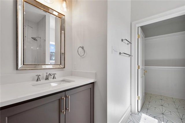 bathroom featuring vanity, a shower, and tile patterned flooring