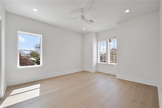 empty room featuring light hardwood / wood-style floors and ceiling fan