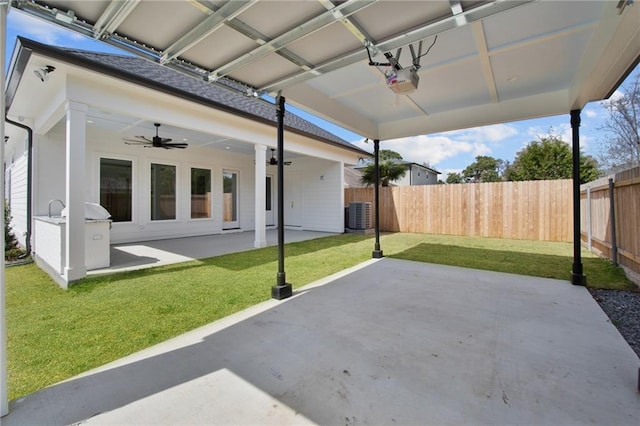 view of patio with central air condition unit and ceiling fan