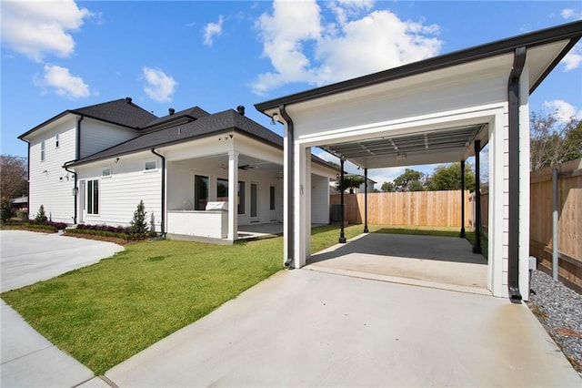 exterior space with a front lawn, a patio, and ceiling fan