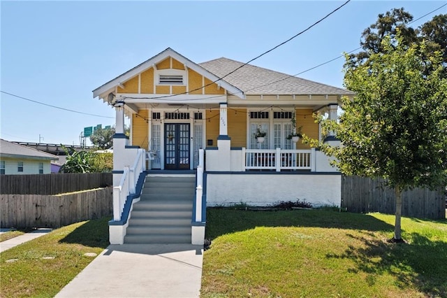 2724 Clover St, New Orleans, LA 70122 - bungalow-style house with french doors and covered porch