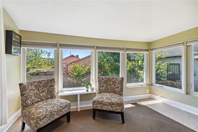 2724 Clover St, New Orleans, LA 70122 - sunroom / solarium with baseboards, tile patterned flooring, and carpet