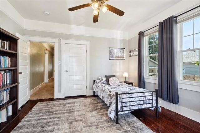 2724 Clover St, New Orleans, LA 70122 - bedroom with wood finished floors, baseboards, and ceiling fan