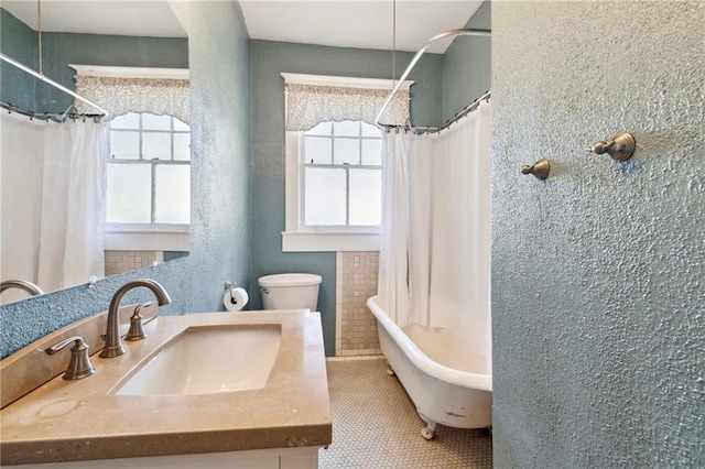 2724 Clover St, New Orleans, LA 70122 - bathroom with plenty of natural light, a shower with shower curtain, a bathtub, and vanity