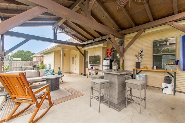 view of patio / terrace with a gazebo, exterior bar, and ceiling fan