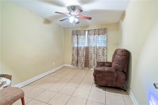 sitting room with ceiling fan and light tile patterned floors