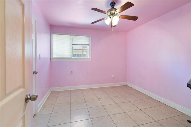 tiled spare room with ceiling fan