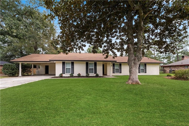 ranch-style house with a carport and a front yard