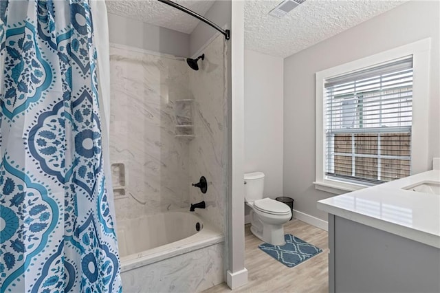 full bathroom with shower / bathtub combination with curtain, vanity, a textured ceiling, and hardwood / wood-style flooring