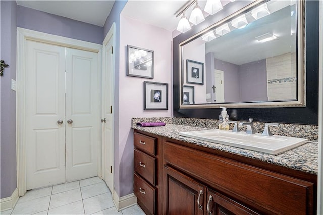 bathroom with tile patterned flooring and vanity