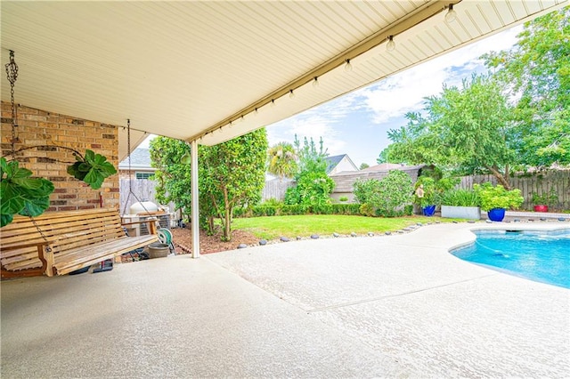 exterior space featuring a lawn and a patio area