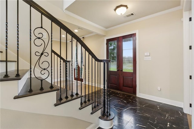 entryway featuring ornamental molding