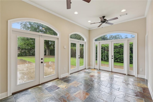 doorway with french doors, ceiling fan, and a wealth of natural light